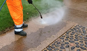 Pressure cleaning concrete driveway